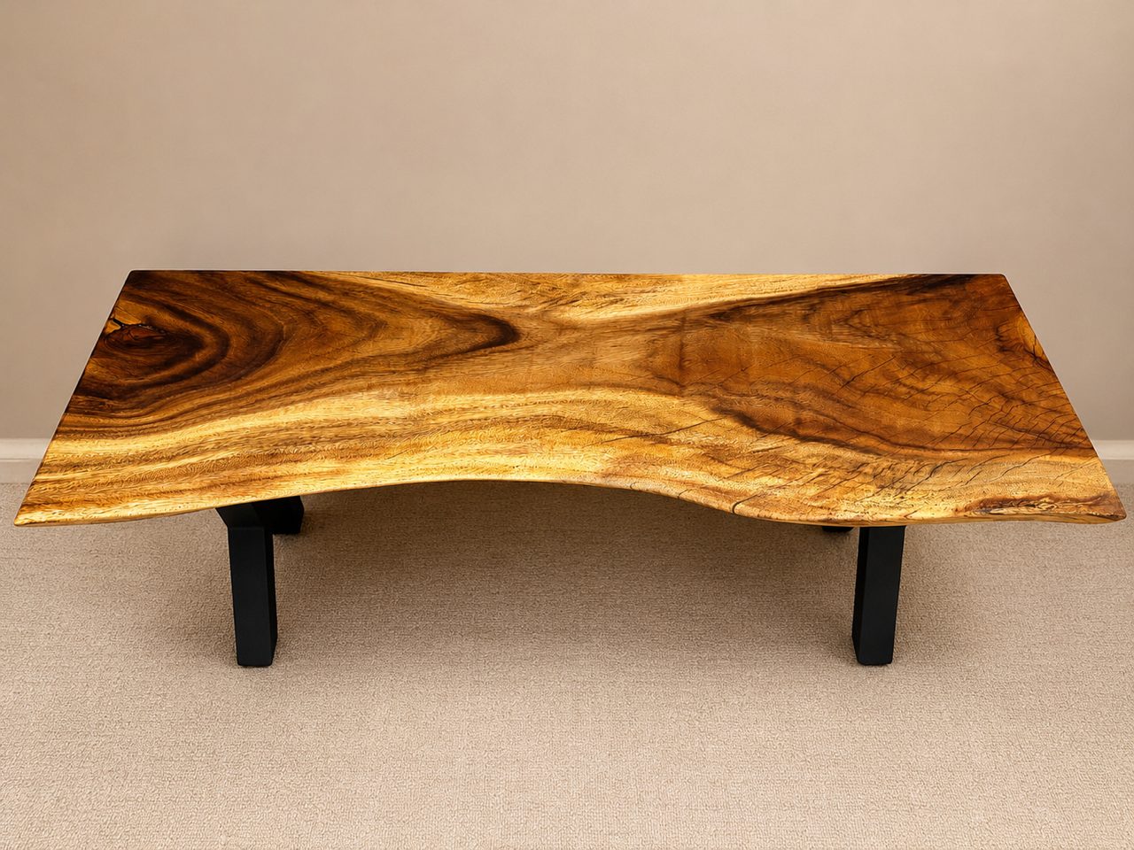 Sculptural live-edge monkey pod bench with a natural curl, by Lost Species